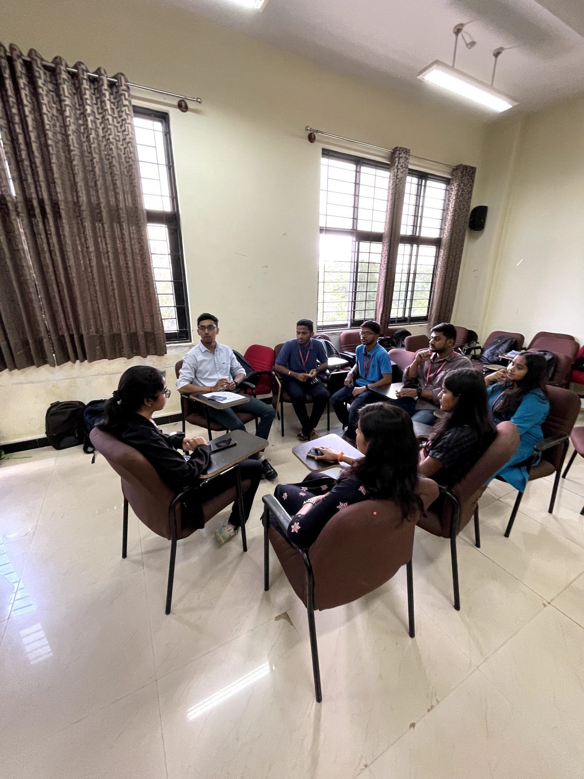 Students in a discussion circle at the BMSIT open course